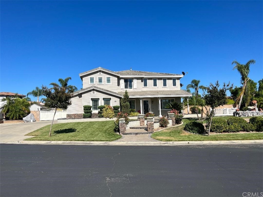 6937 Columbia Court Rancho Cucamonga, CA 91739 - Photo 1 of 1 a front view of a house with garden