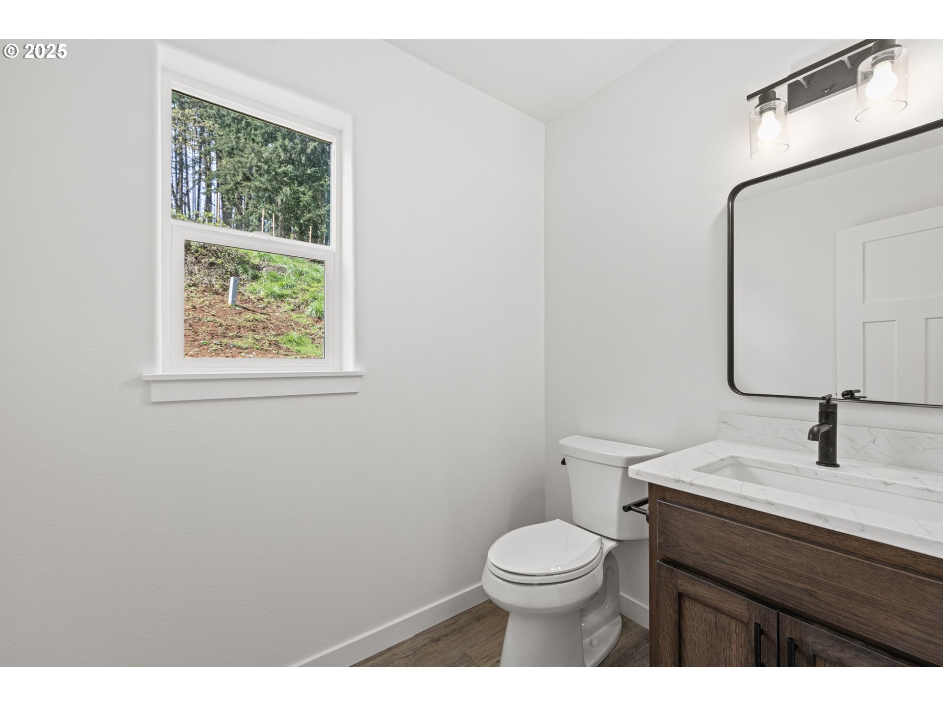 65 Bangle Court Cottage Grove, OR 97424 - Photo 18 of 44 a bathroom with a sink a toilet and a mirror