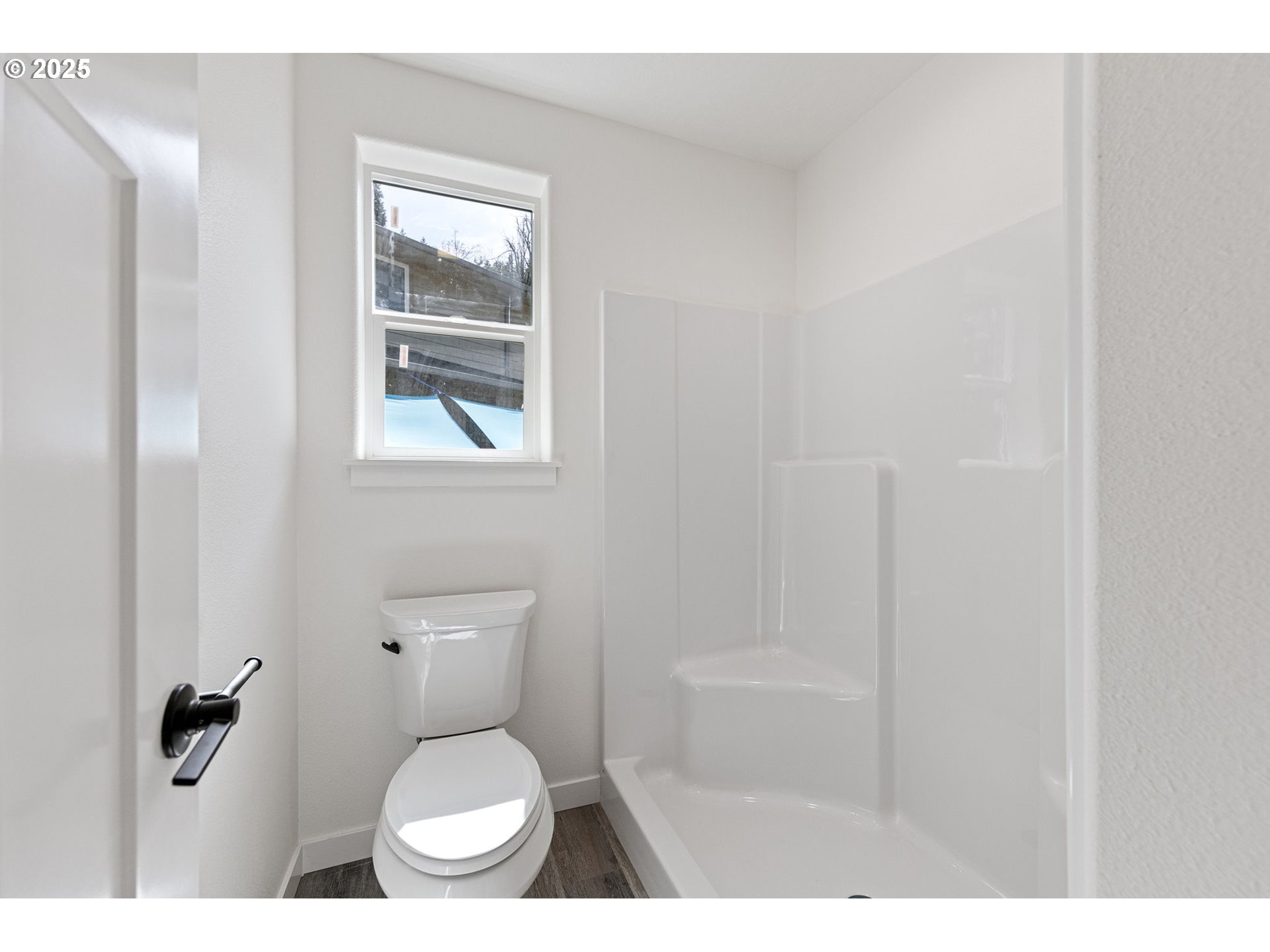 65 Bangle Court Cottage Grove, OR 97424 - Photo 26 of 44 a bathroom with a toilet and a shower