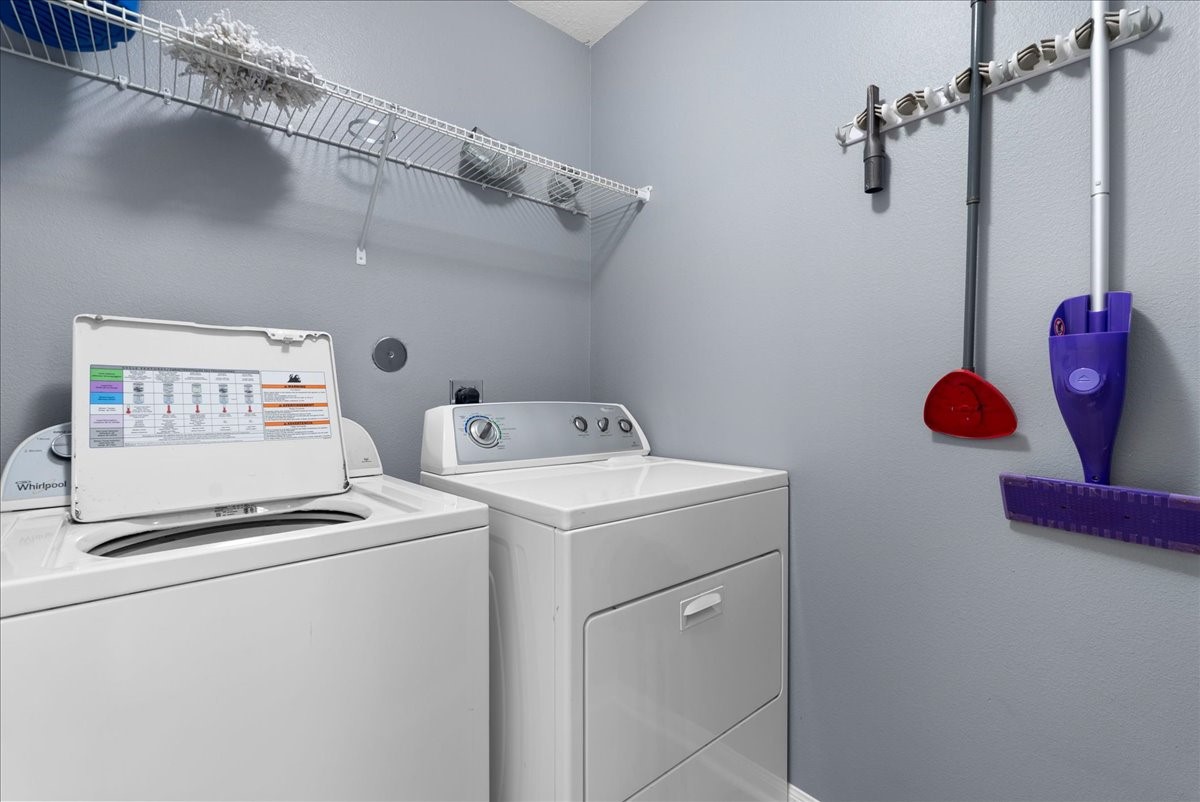 5727 Treasure Cove Road Cove, TX 77523 - Photo 14 of 20 a utility room with dryer and washer