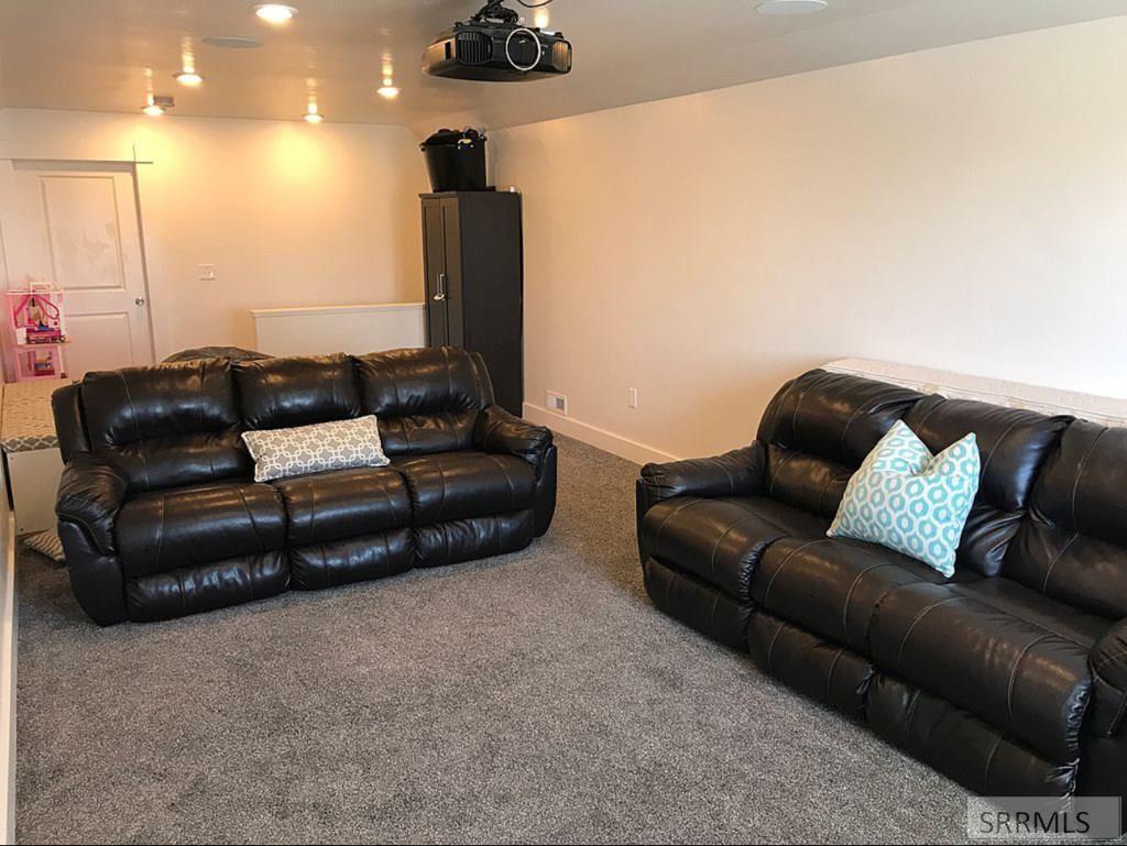 161 Walnut Street Ashton, ID 83420 - Photo 31 of 33 Upstairs Living room/theatre room