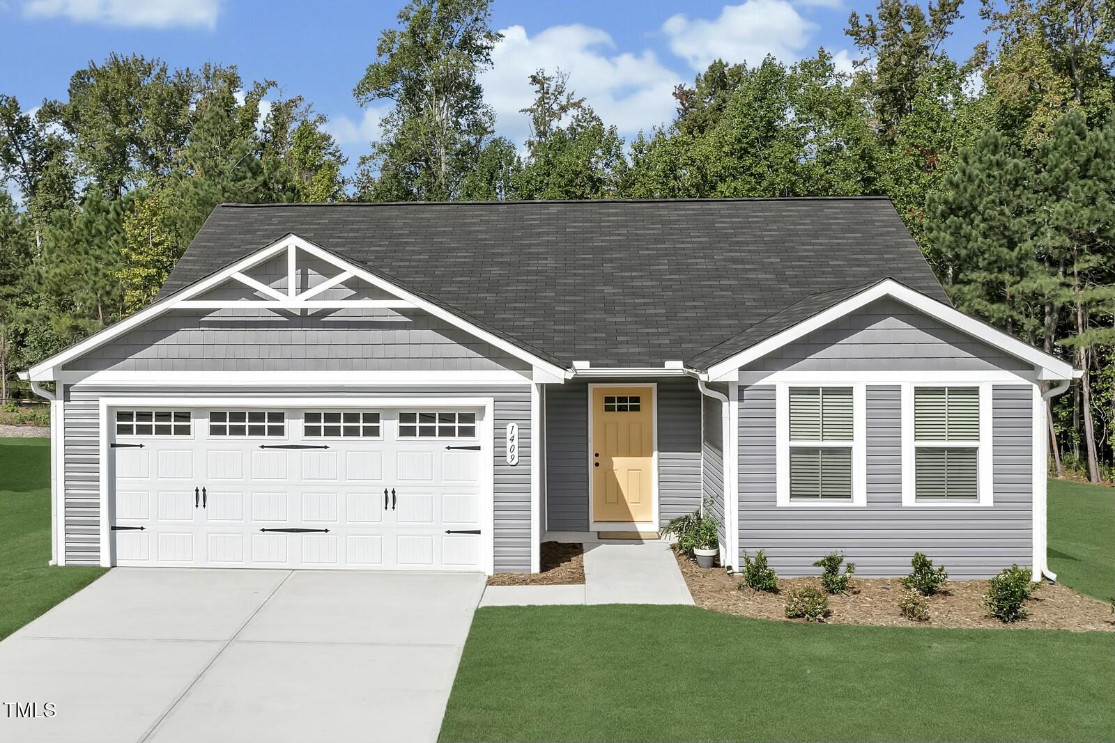 3941 Dragonfly Road Bailey, NC 27807 - Photo 1 of 12 a front view of a house with a yard