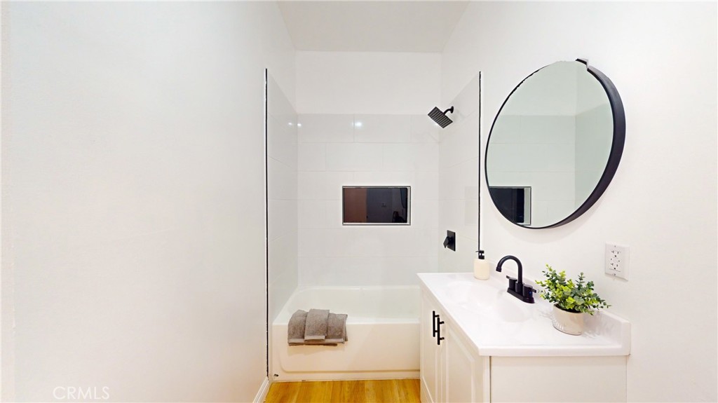 411 West Plum Street Compton, CA 90222 - Photo 6 of 14 a bathroom with a sink and a mirror