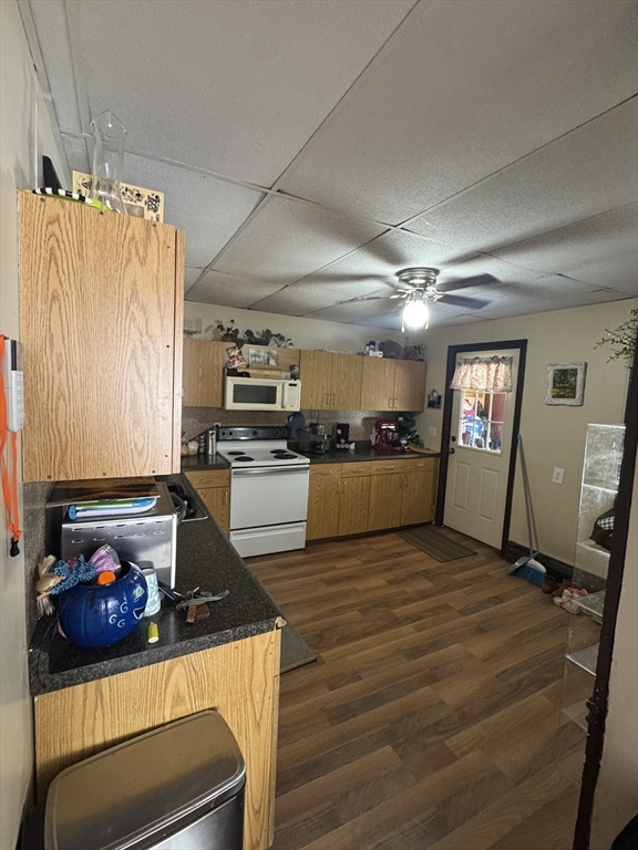 27 Pleasant Street, Unit A Templeton, MA 01468 - Photo 5 of 15 a kitchen with a refrigerator and a stove top oven