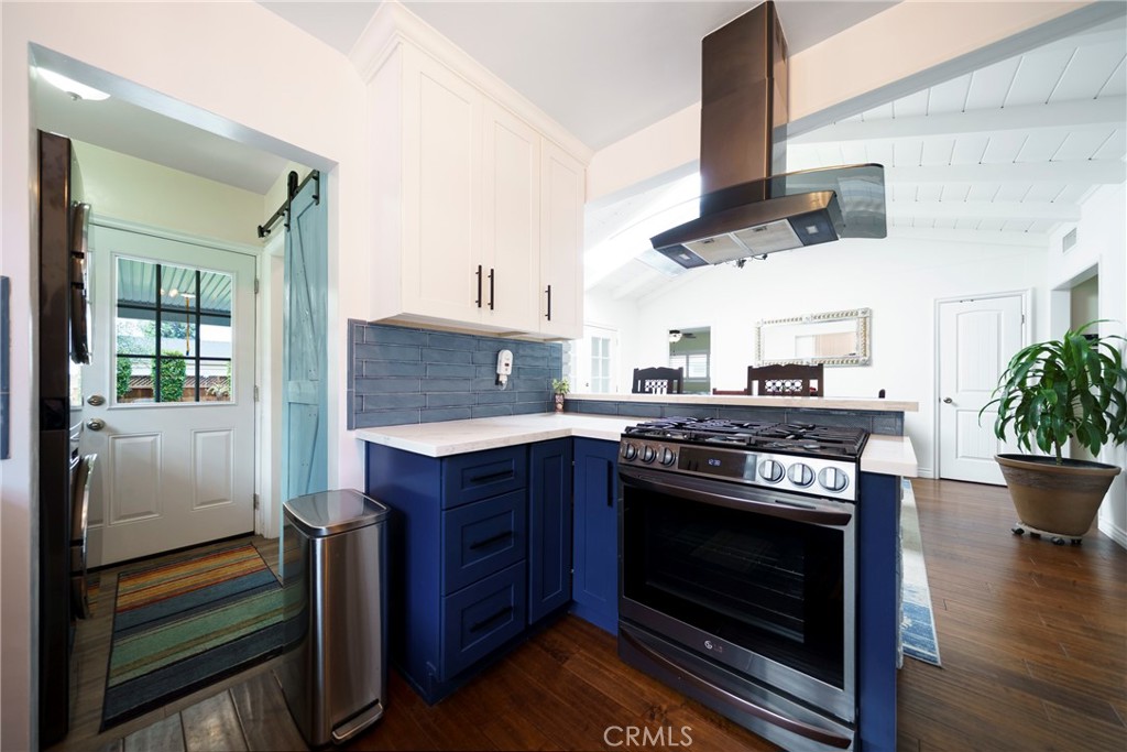 6937 Broadway Whittier, CA 90606 - Photo 11 of 27 a kitchen with a stove and a wooden floors