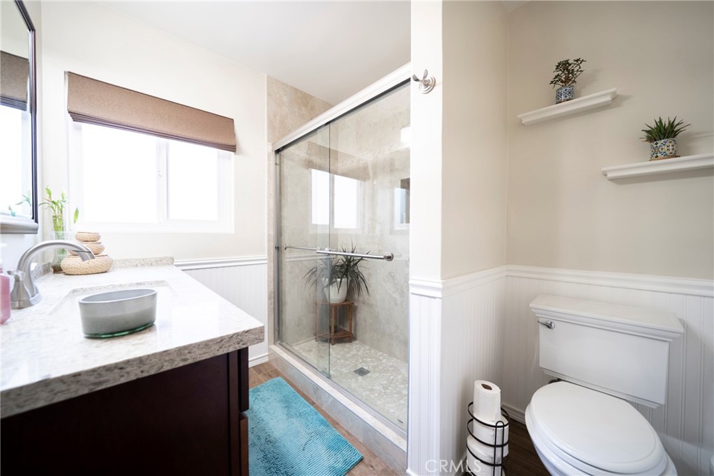 6937 Broadway Whittier, CA 90606 - Photo 15 of 27 a bathroom with a sink a toilet and shower