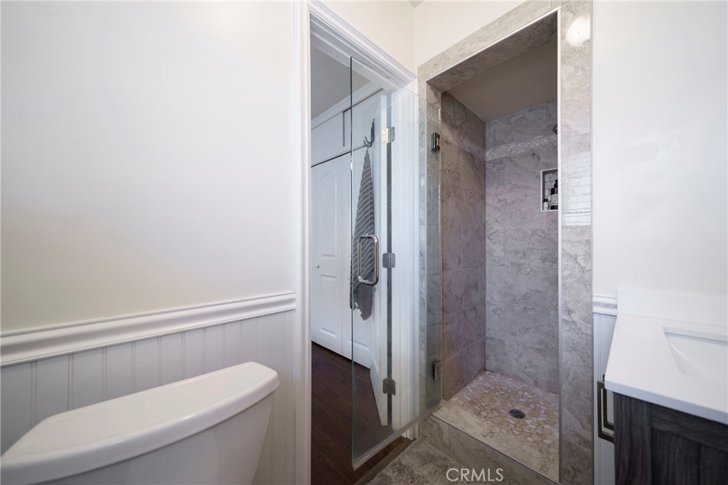 6937 Broadway Whittier, CA 90606 - Photo 18 of 27 a bathroom with a shower and toilet