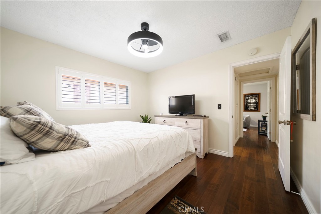 6937 Broadway Whittier, CA 90606 - Photo 10 of 27 a bedroom with a bed and a television