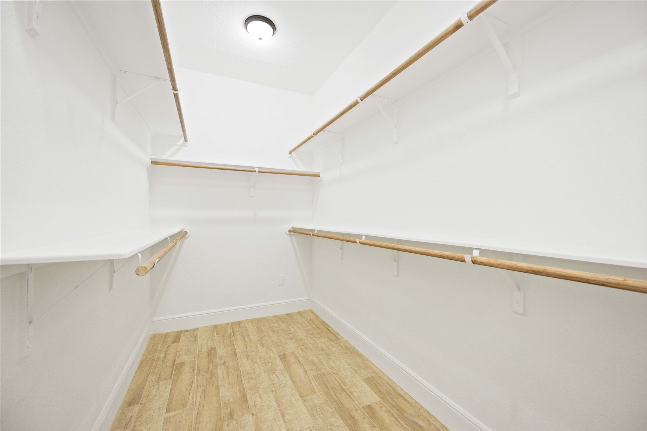 4651 Mallow Street, Unit B Houston, TX 77051 - Photo 16 of 22 a view of walk in closet with empty racks