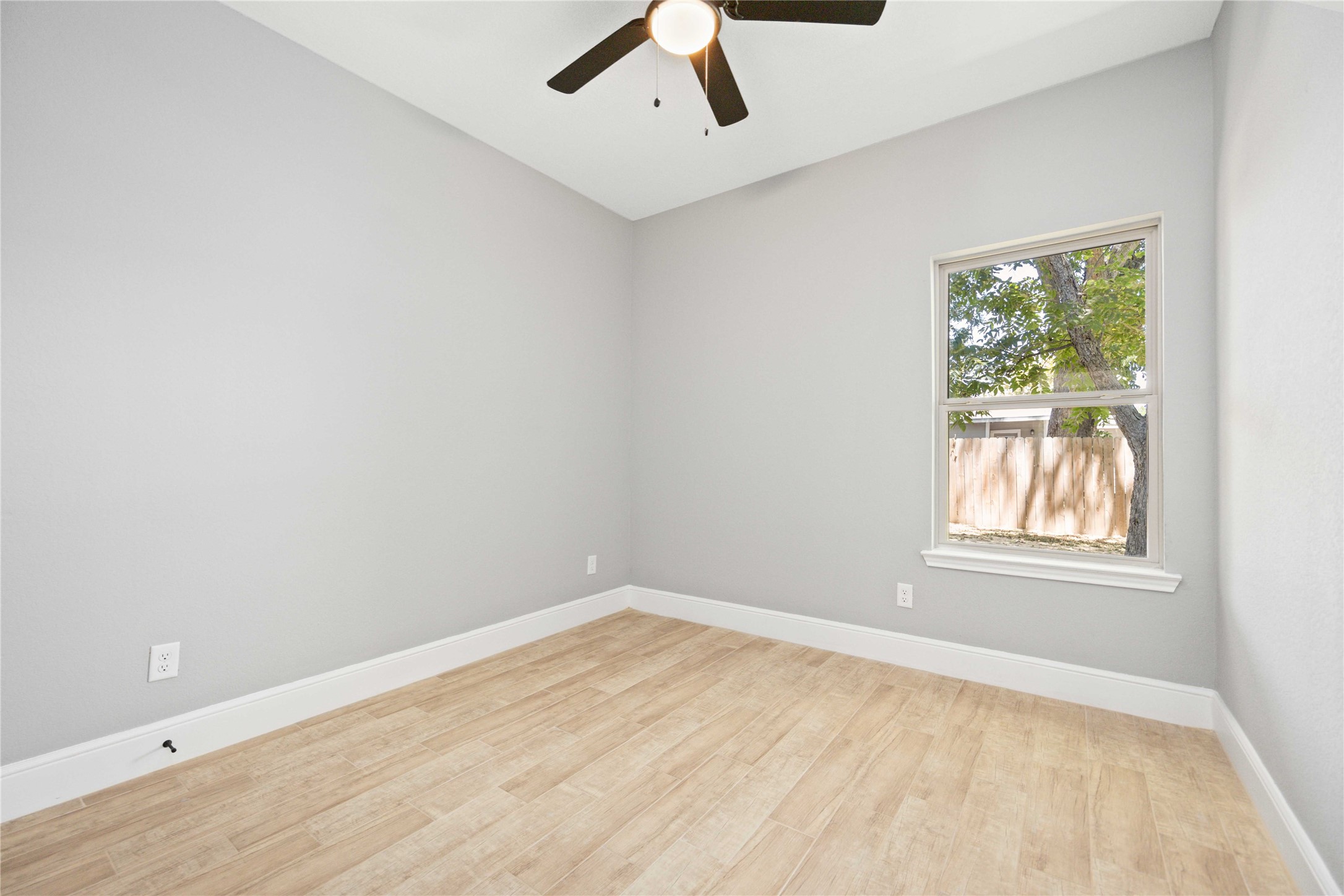 4651 Mallow Street, Unit B Houston, TX 77051 - Photo 19 of 22 an empty room with a window