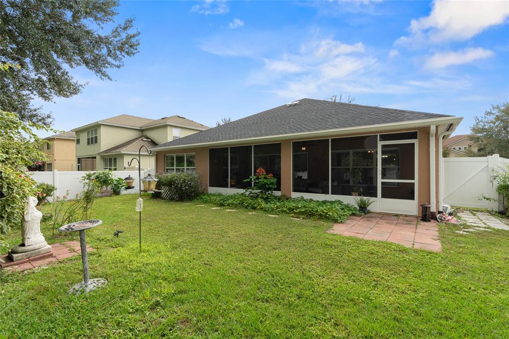 4683 Southwest 40th Place Ocala, FL 34474 - Photo 27 of 43 a view of a house with a yard and sitting area