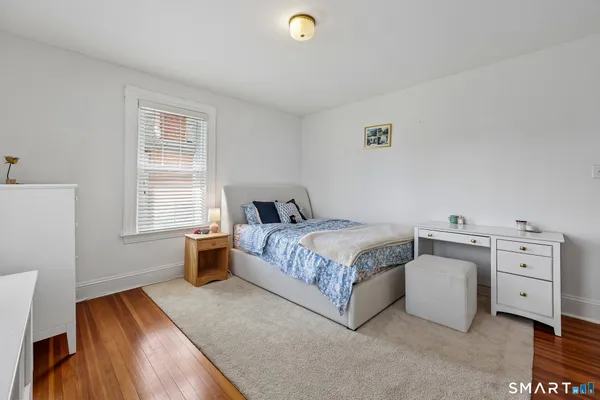 a bed room with a bed and a window