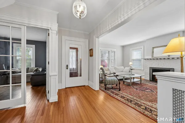 a living room with furniture and a fireplace