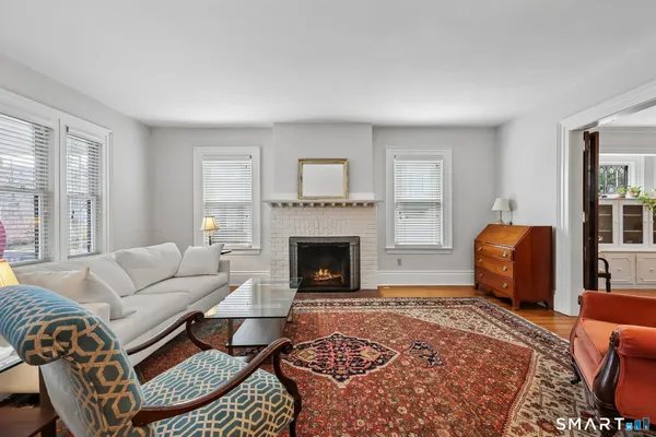 a living room with furniture and a rug