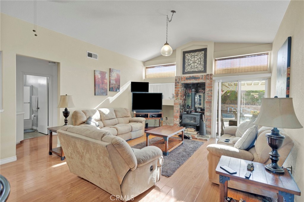14405 Cedar Street Hesperia, CA 92344 - Photo 12 of 48 a living room with furniture wooden floor and a flat screen tv