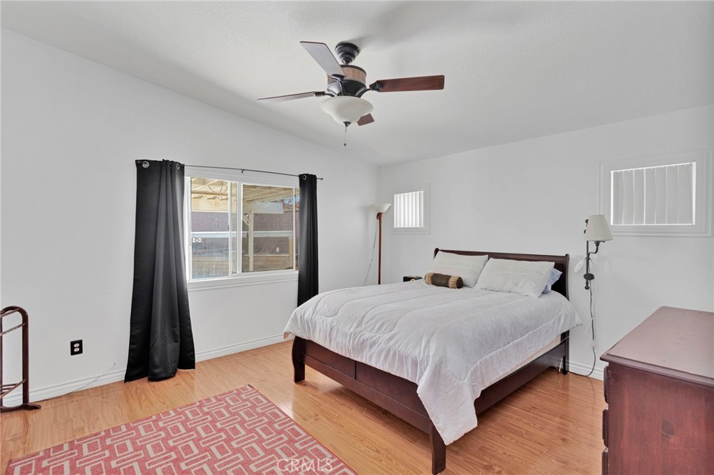 14405 Cedar Street Hesperia, CA 92344 - Photo 17 of 48 a bedroom with a large bed and a window