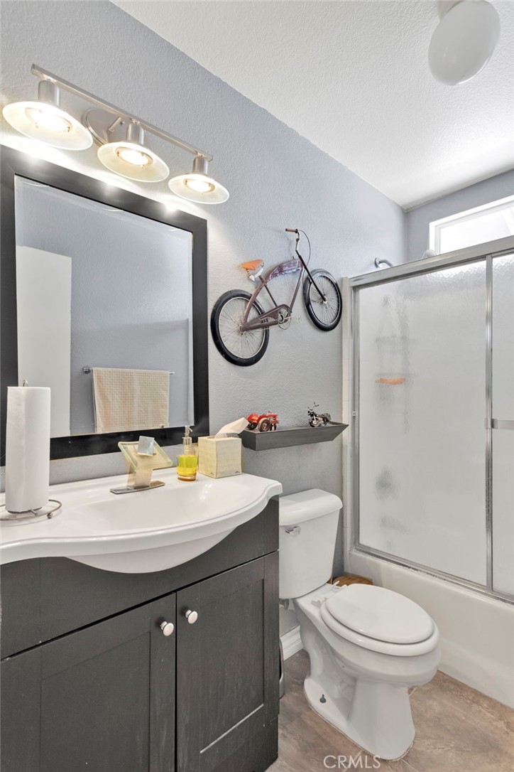 14405 Cedar Street Hesperia, CA 92344 - Photo 28 of 48 a bathroom with a sink a toilet and shower