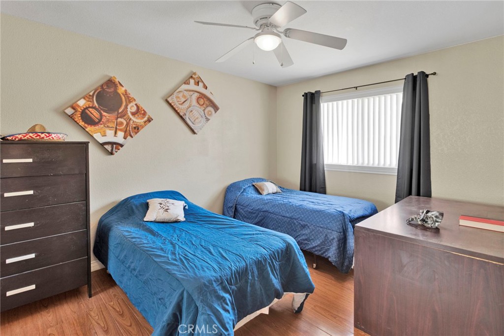 14405 Cedar Street Hesperia, CA 92344 - Photo 30 of 48 a bedroom with two beds and a window
