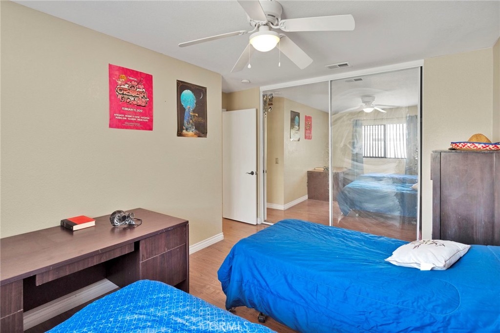 14405 Cedar Street Hesperia, CA 92344 - Photo 31 of 48 a living room with furniture and wooden floor