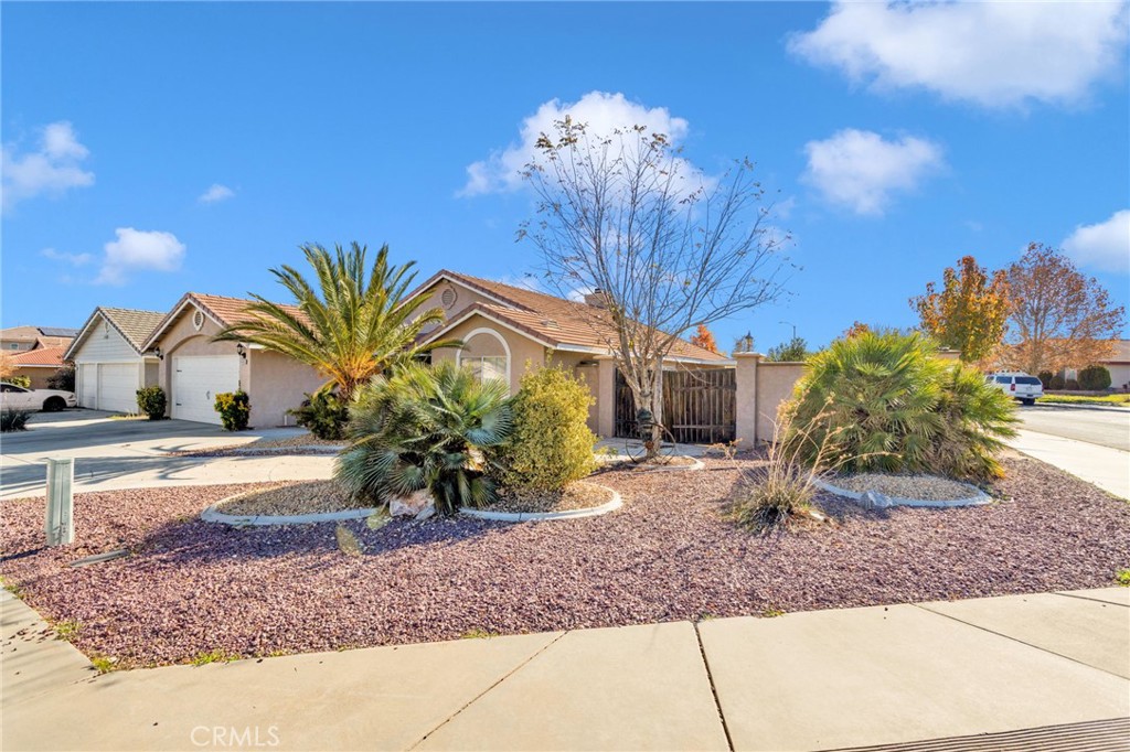 14405 Cedar Street Hesperia, CA 92344 - Photo 7 of 48 a view of a house with backyard porch and sitting area
