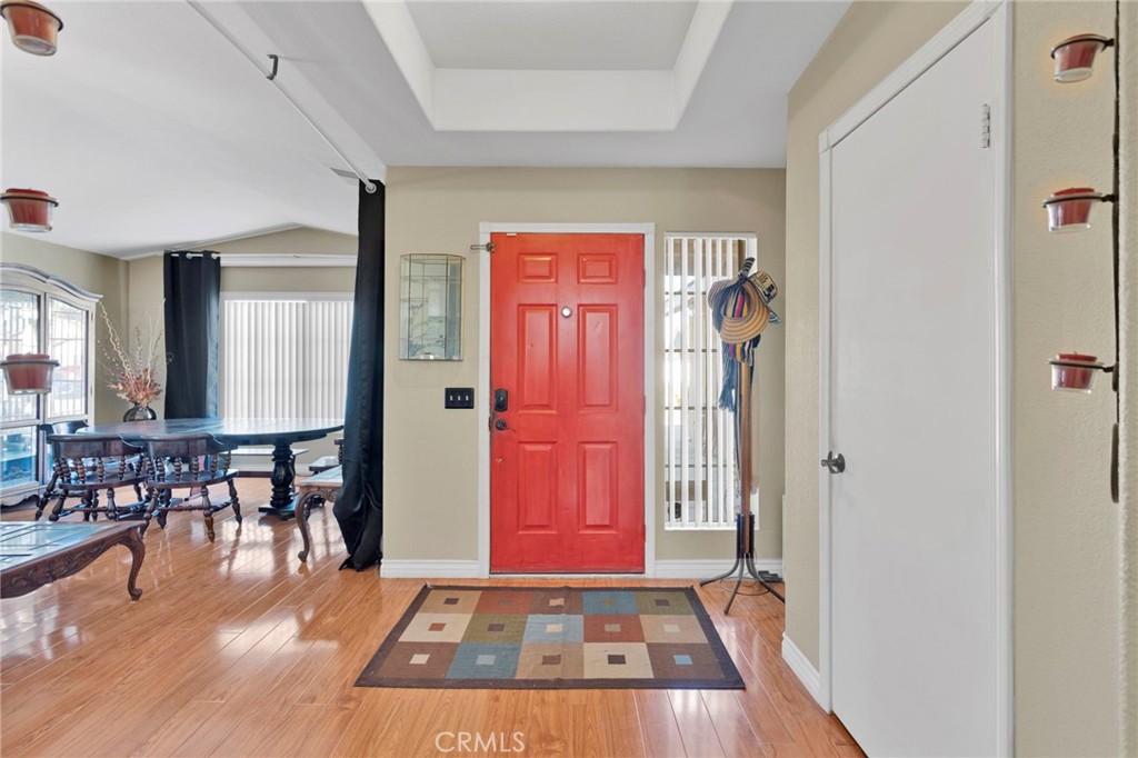 14405 Cedar Street Hesperia, CA 92344 - Photo 9 of 48 a view of a livingroom with furniture wooden floor and front door