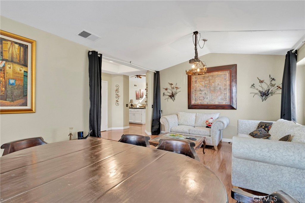 14405 Cedar Street Hesperia, CA 92344 - Photo 10 of 48 a bedroom with furniture and a chandelier