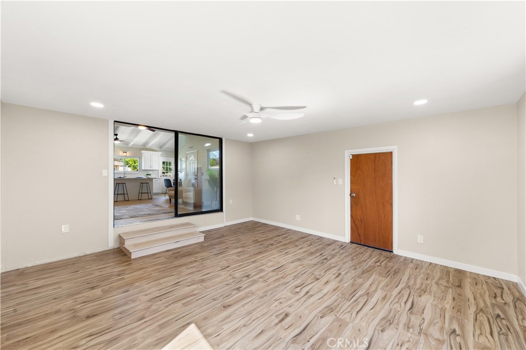 17042 Rorimer Street La Puente, CA 91744 - Photo 10 of 31 Bright and airy family room with large windows that invite an abundance of natural light throughout the space.