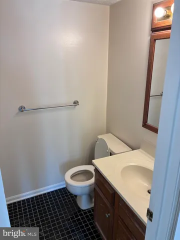 a white toilet sitting next to a shower