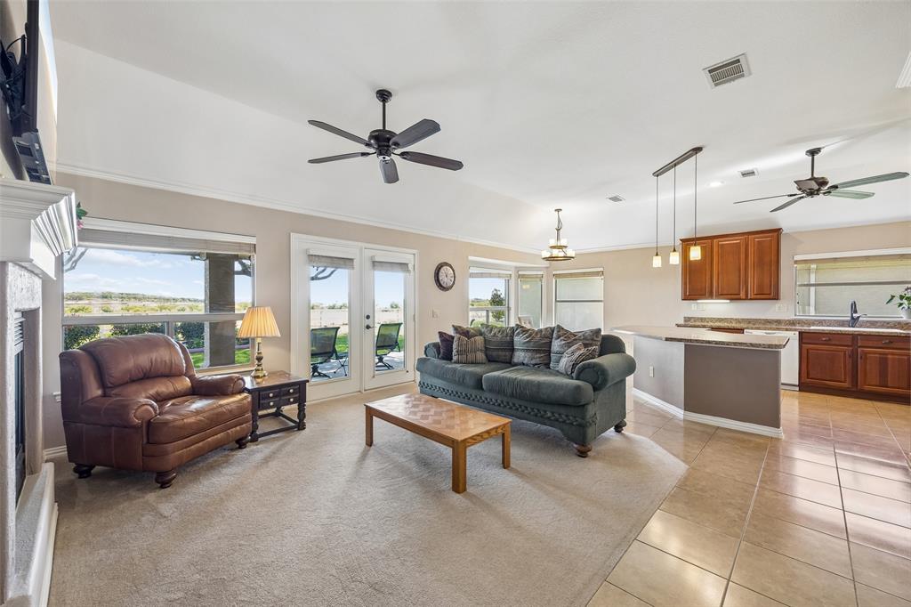 9221 Perimeter Street Denton, TX 76207 - Photo 7 of 36 a living room with furniture and kitchen view