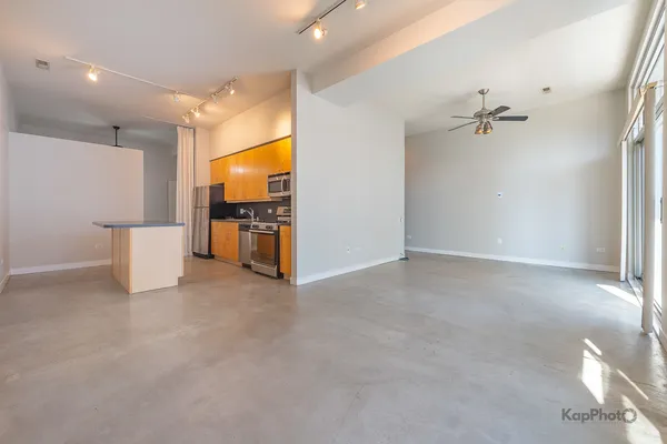 a kitchen with stainless steel appliances a stove refrigerator sink and cabinets