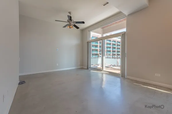 a view of empty room with windows