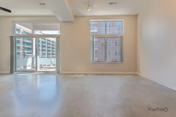a view of a balcony with a floor to ceiling window