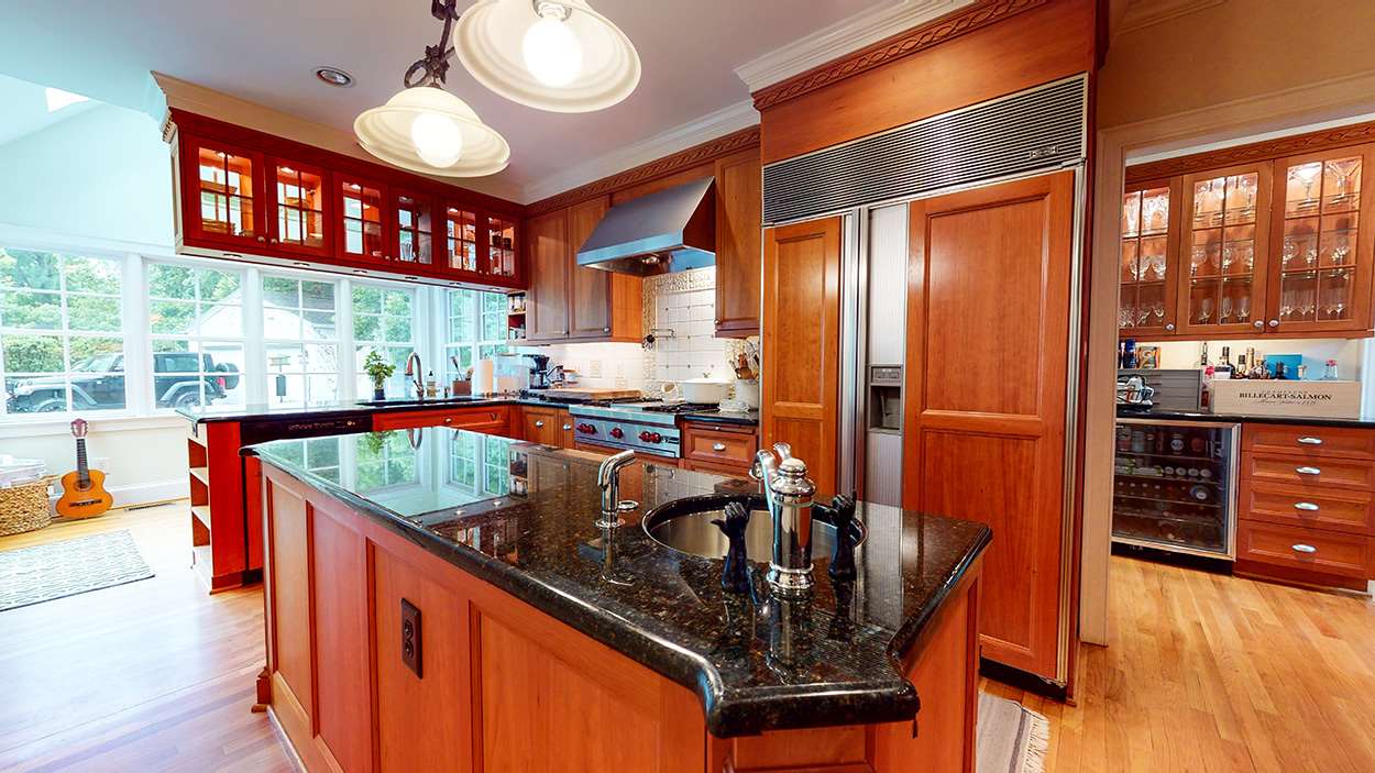 3816 Dover Road Durham, NC 27707 - Photo 13 of 30 a kitchen with stainless steel appliances granite countertop a sink a stove and a wooden floors