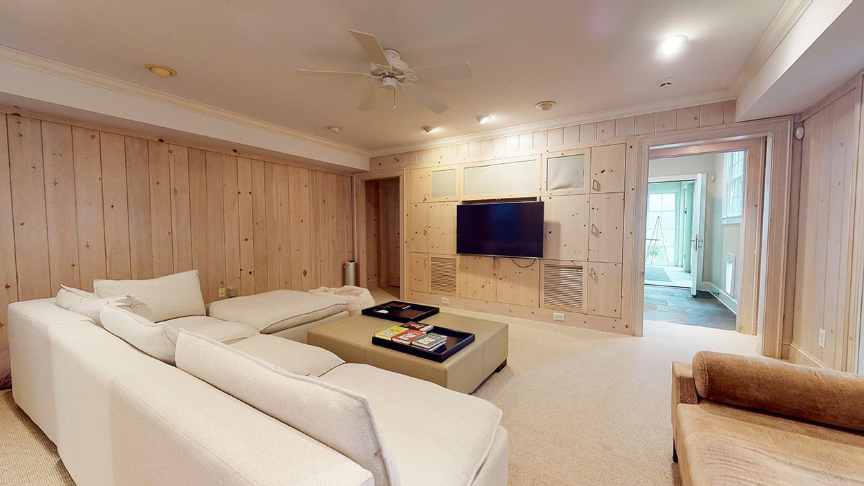 3816 Dover Road Durham, NC 27707 - Photo 16 of 30 a living room with furniture a flat screen tv and a couch