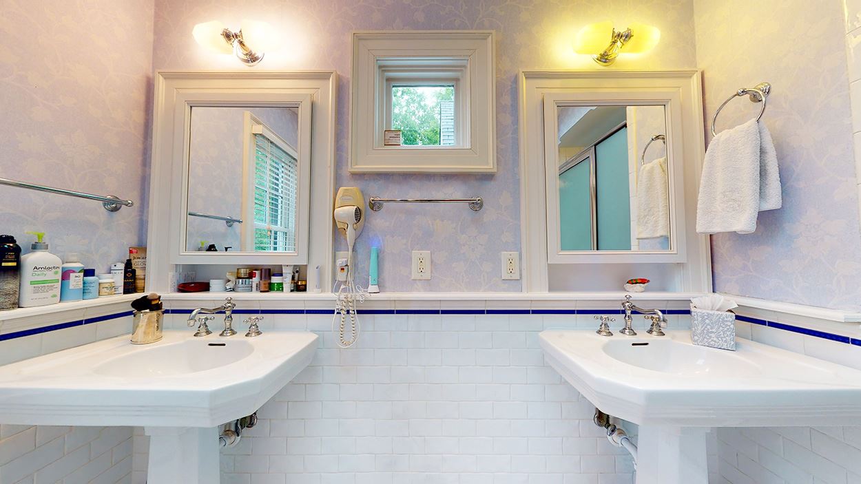 3816 Dover Road Durham, NC 27707 - Photo 20 of 30 a bathroom with a sink and a mirror