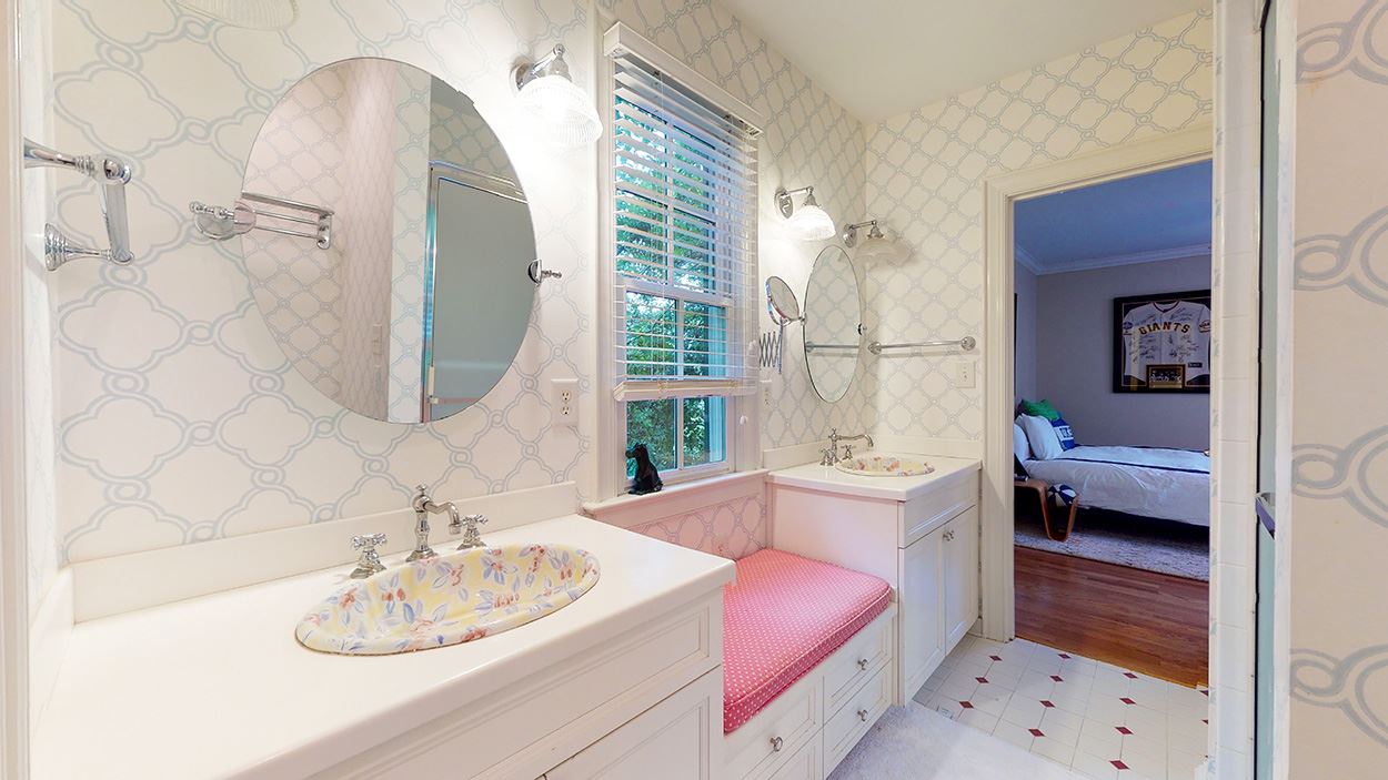 3816 Dover Road Durham, NC 27707 - Photo 25 of 30 a en suite bathroom with a sink double vanity and a mirror