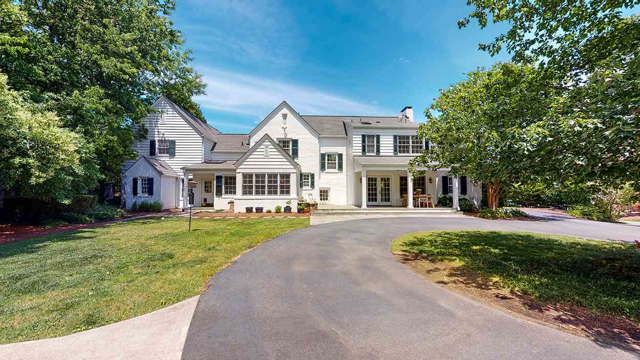3816 Dover Road Durham, NC 27707 - Photo 27 of 30 a front view of a house with a yard porch and outdoor seating