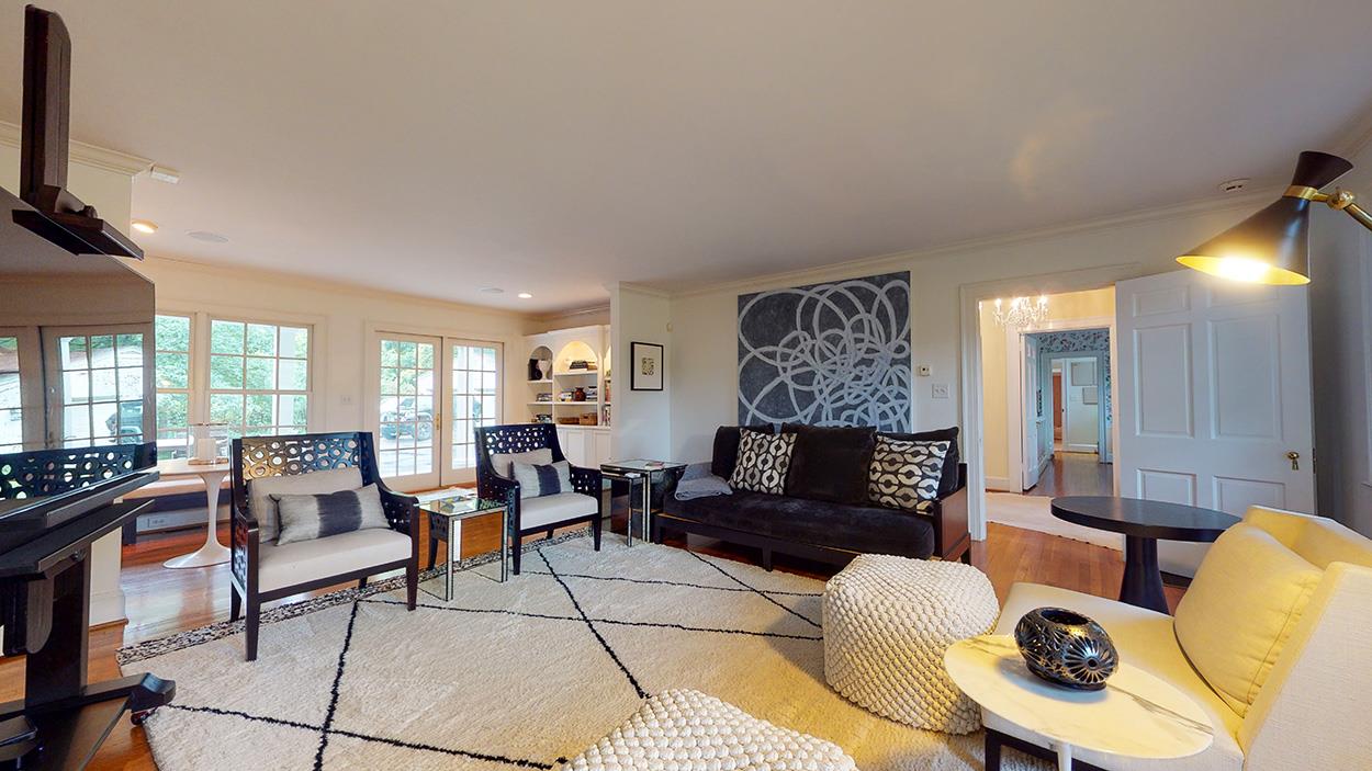 3816 Dover Road Durham, NC 27707 - Photo 5 of 30 a living room with furniture and a flat screen tv
