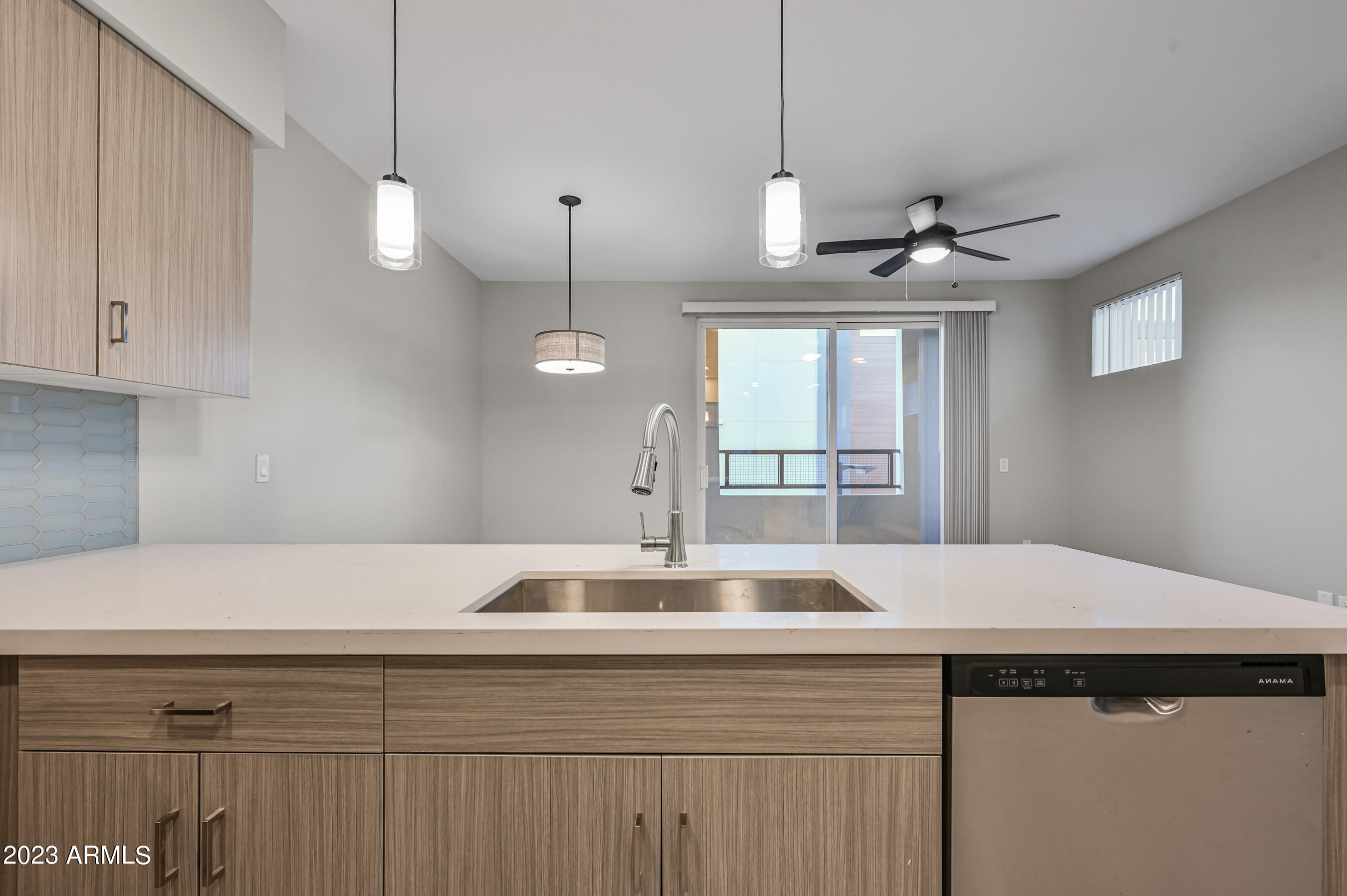 1023 West 5th Street, Unit 1006 Tempe, AZ 85281 - Photo 15 of 35 a view of kitchen with a sink and chandelier