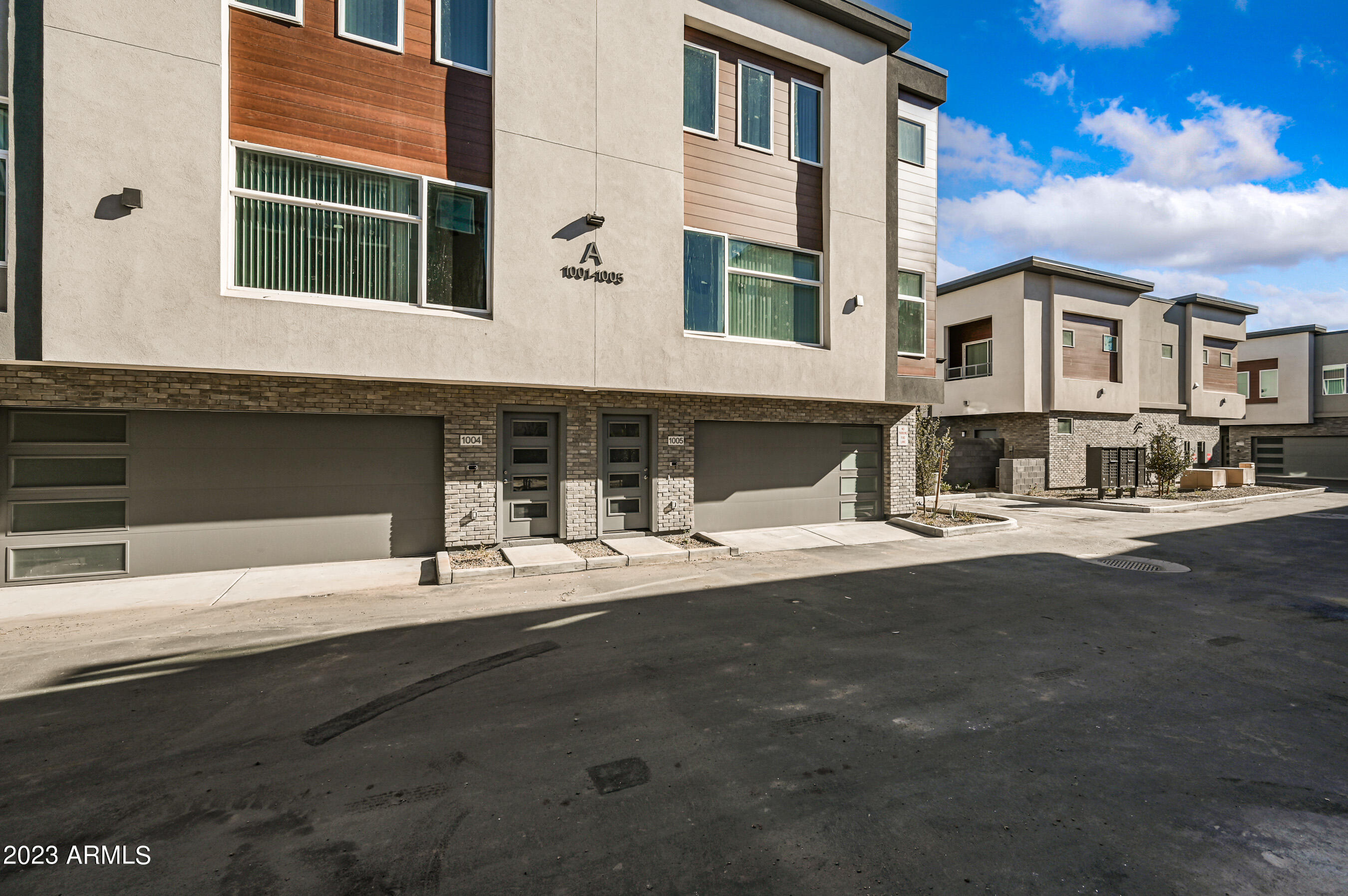 1023 West 5th Street, Unit 1006 Tempe, AZ 85281 - Photo 26 of 35 a front view of a building with a road