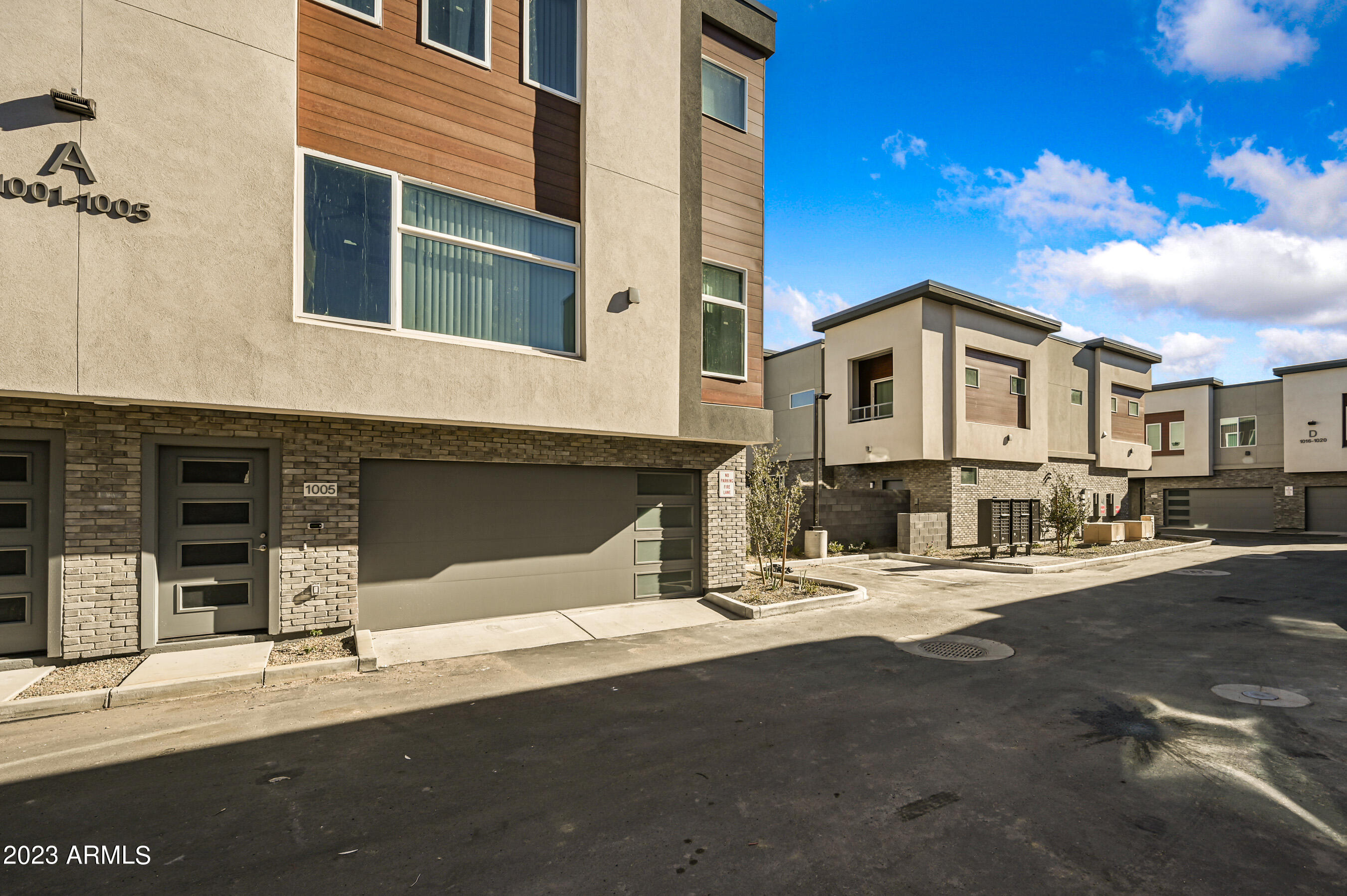 1023 West 5th Street, Unit 1006 Tempe, AZ 85281 - Photo 27 of 35 a front view of a house with a road