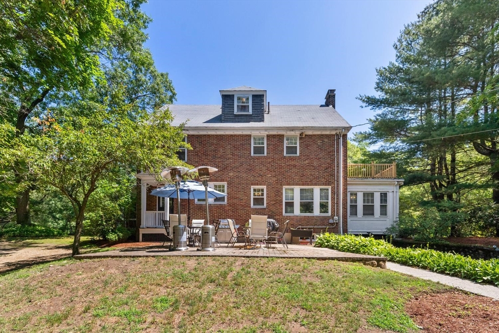 114 South Border Road Medford, MA 02155 - Photo 3 of 36 a front view of a house with garden