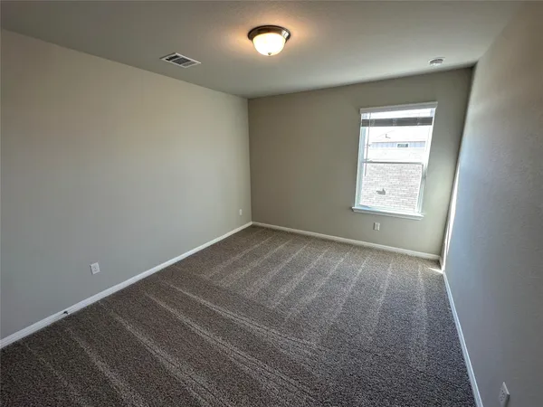 a bathroom with a double vanity sink and mirror