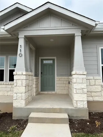 a front view of a house with garage