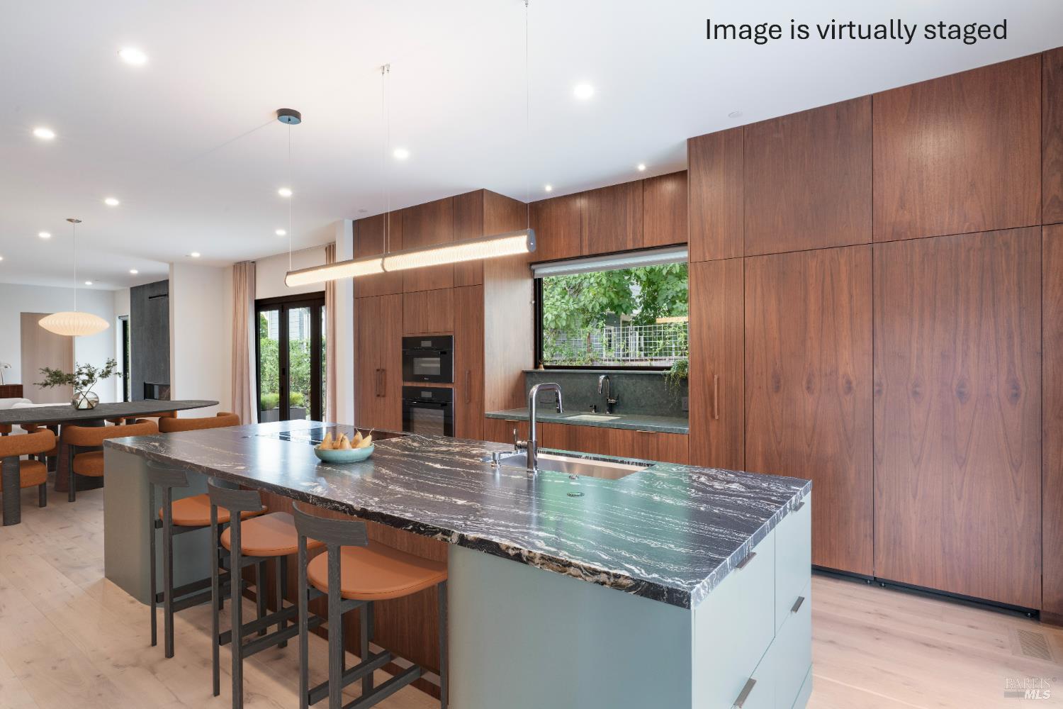983 Grove Street Healdsburg, CA 95448 - Photo 14 of 52 a kitchen with kitchen island granite countertop wooden cabinets a dining table and chairs