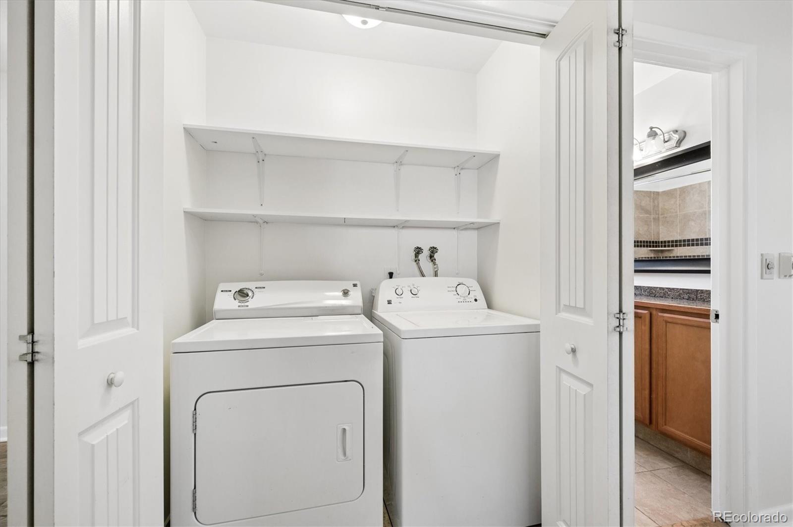 6640 South Williams Circle West Centennial, CO 80121 - Photo 15 of 23 a utility room with dryer and washer