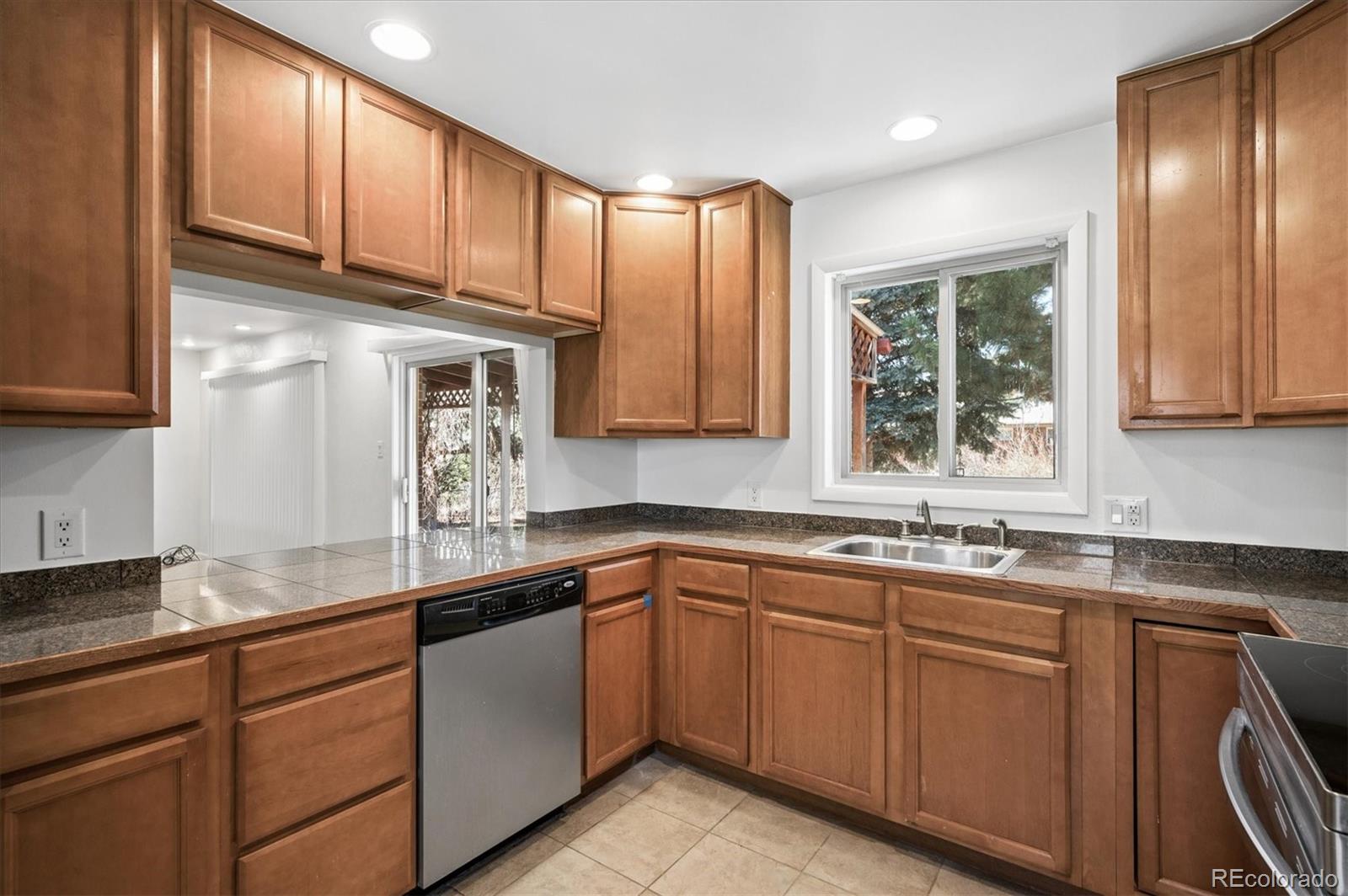 6640 South Williams Circle West Centennial, CO 80121 - Photo 8 of 23 a kitchen with sink cabinets and window