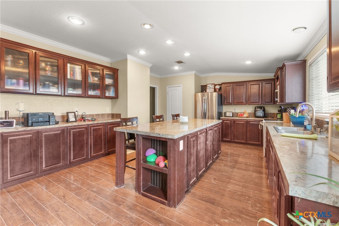 411 Private Road 3447 Kempner, TX 76539 - Photo 2 of 33 a kitchen with stainless steel appliances lots of counter top space