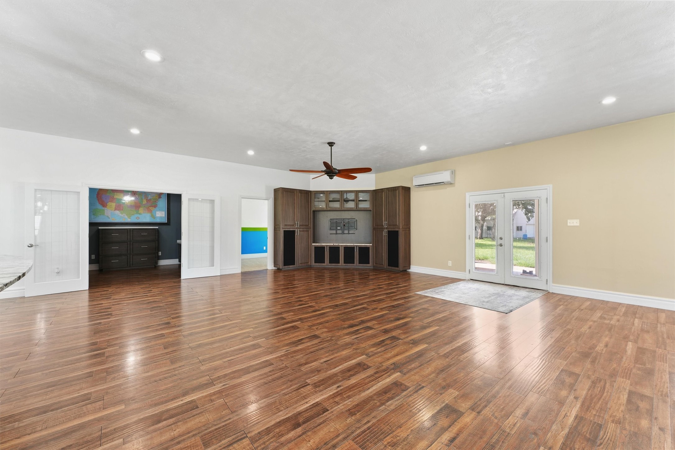 43919 Austin Branch Road Hempstead, TX 77445 - Photo 13 of 48 Anchored by a stunning custom-built entertainment center, this room offers the perfect blend of function and refined farmhouse charm.