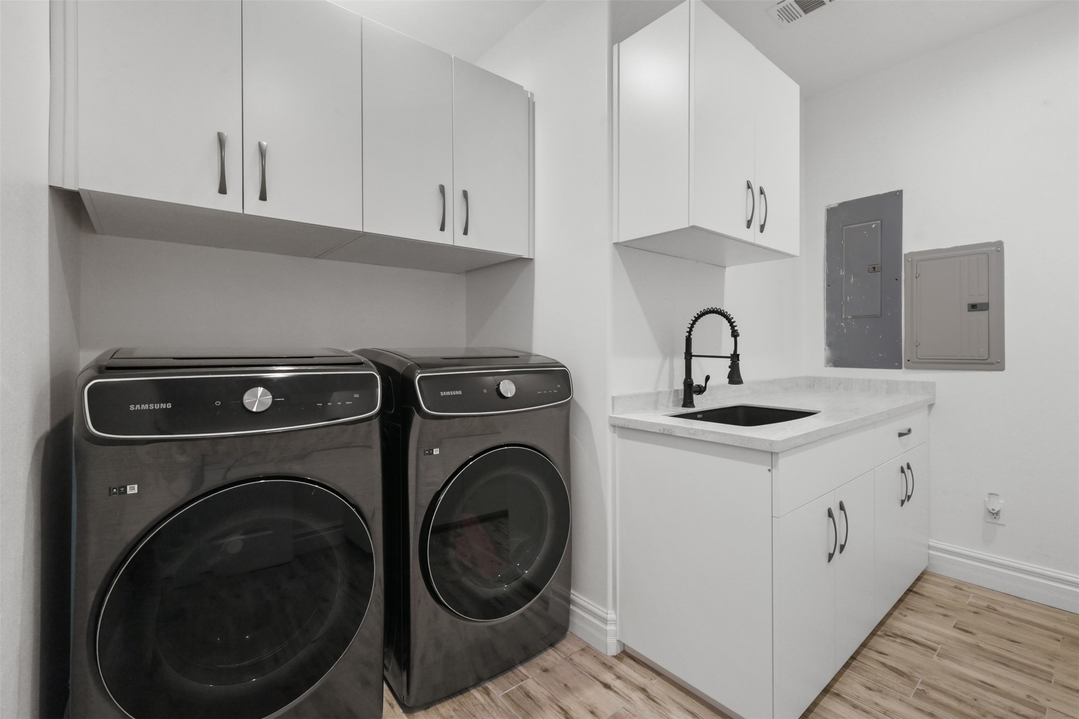 43919 Austin Branch Road Hempstead, TX 77445 - Photo 28 of 48 Expanisve utility room offering private sink and cabinetry.